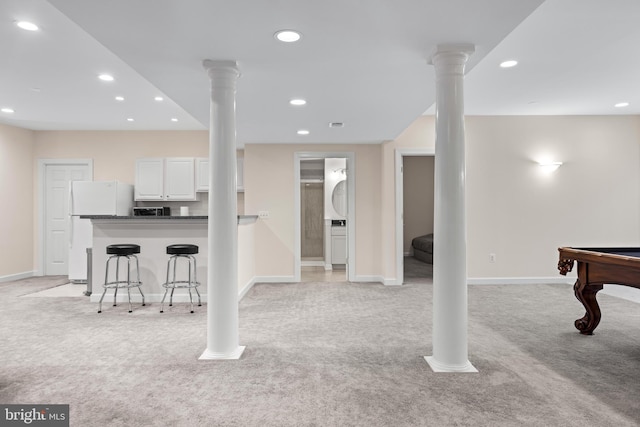 interior space featuring recessed lighting, light carpet, and ornate columns