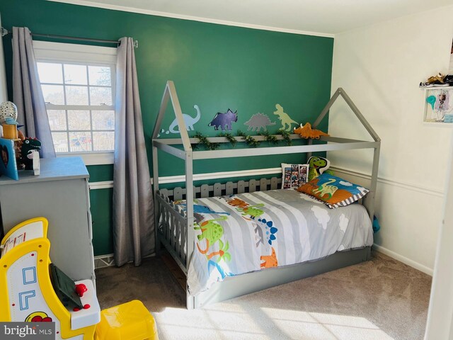 carpeted bedroom featuring baseboards