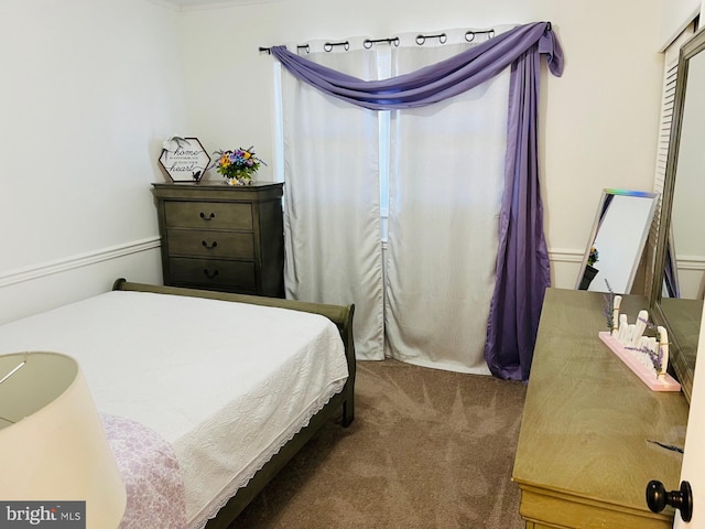 bedroom with dark carpet