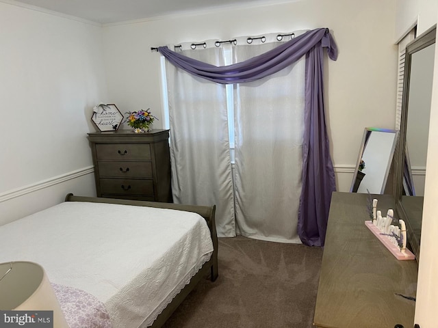 carpeted bedroom featuring ornamental molding