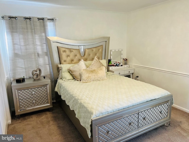 bedroom with baseboards, dark colored carpet, and crown molding