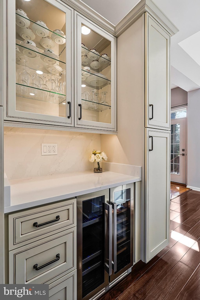 bar featuring tasteful backsplash, dark hardwood / wood-style floors, and wine cooler