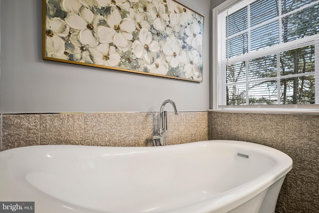 bathroom with sink and a tub