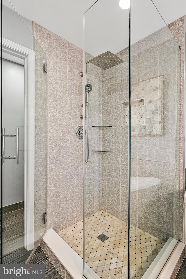 bathroom with a shower with shower door