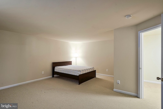 unfurnished bedroom featuring light carpet