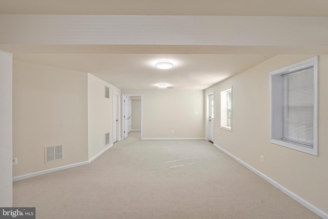 spare room with light colored carpet