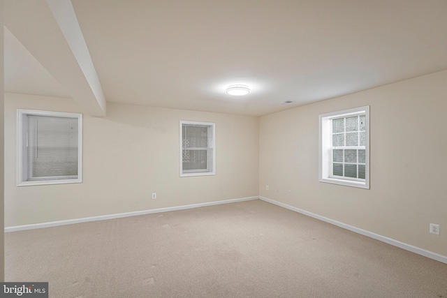 unfurnished room with carpet floors