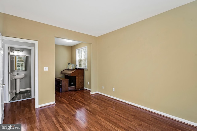 spare room featuring dark hardwood / wood-style flooring