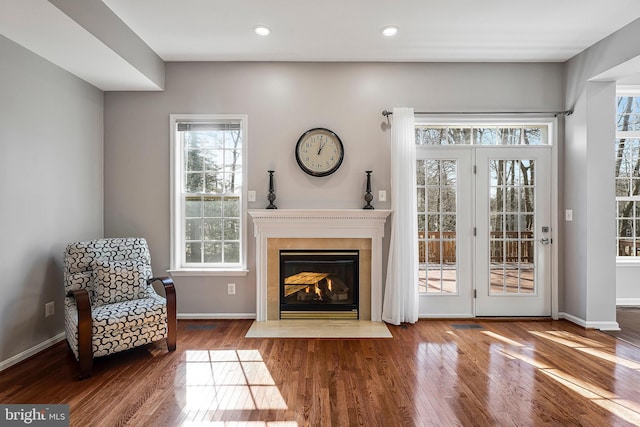 living area with hardwood / wood-style flooring