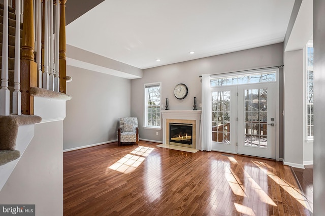 unfurnished living room featuring wood-type flooring