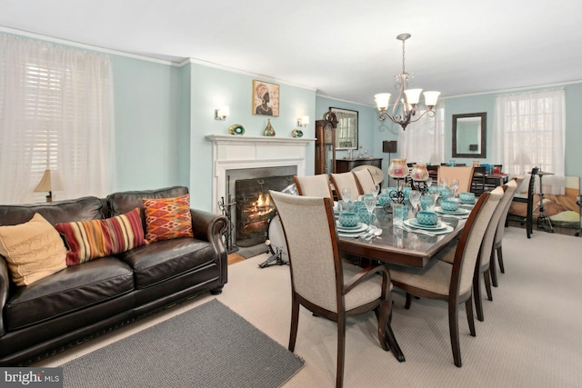 carpeted dining area with ornamental molding and a chandelier