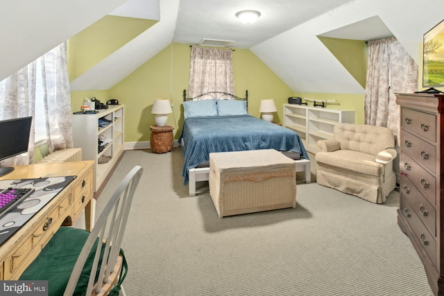 carpeted bedroom featuring lofted ceiling