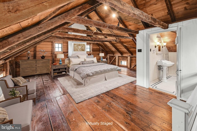 unfurnished bedroom featuring wood-type flooring, vaulted ceiling with beams, wood ceiling, and wood walls