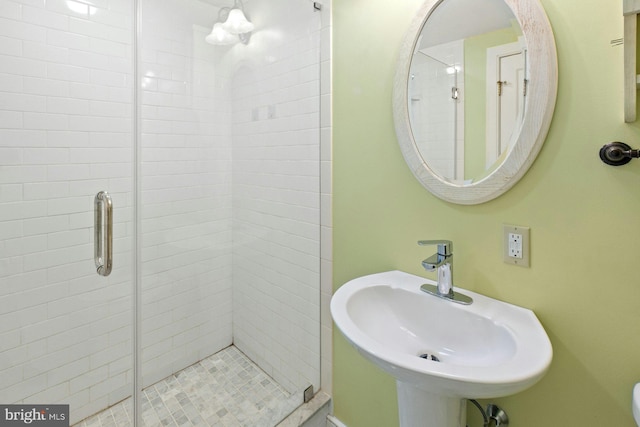 bathroom with sink and walk in shower