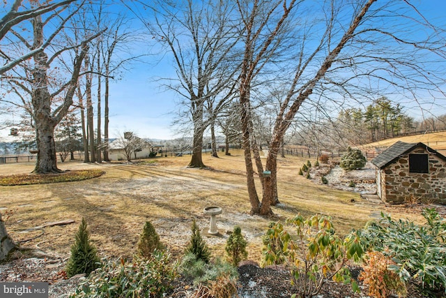 view of yard with a rural view