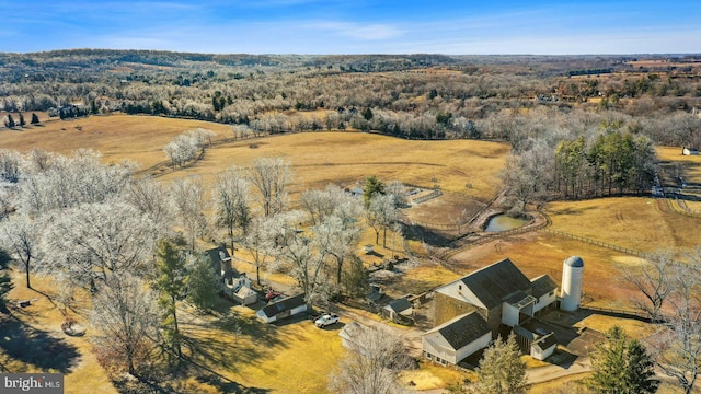 birds eye view of property with a rural view