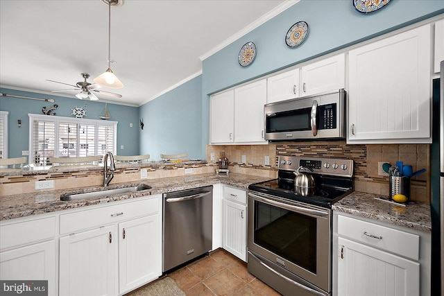 kitchen with crown molding, appliances with stainless steel finishes, white cabinetry, a ceiling fan, and a sink