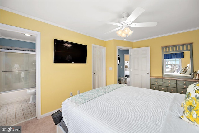 bedroom with a ceiling fan, ensuite bathroom, carpet, crown molding, and baseboards