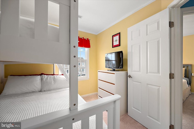 bedroom featuring light colored carpet, visible vents, and ornamental molding