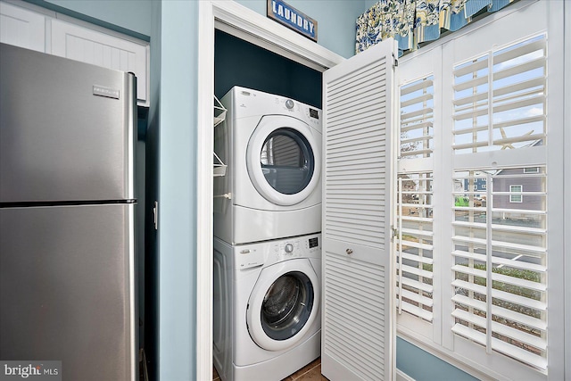 laundry room featuring laundry area and stacked washing maching and dryer