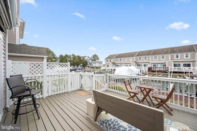 wooden terrace with a residential view