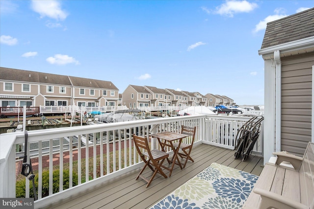 wooden terrace with a residential view