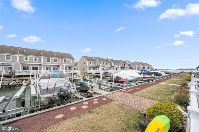 dock area featuring a residential view and boat lift