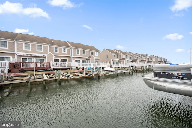 property view of water featuring a residential view and a dock