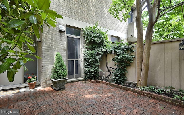 doorway to property with a patio