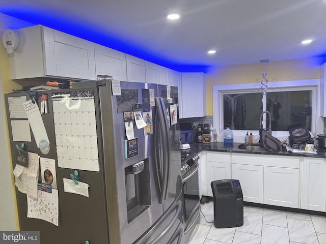 kitchen featuring stainless steel appliances, tasteful backsplash, sink, and white cabinets