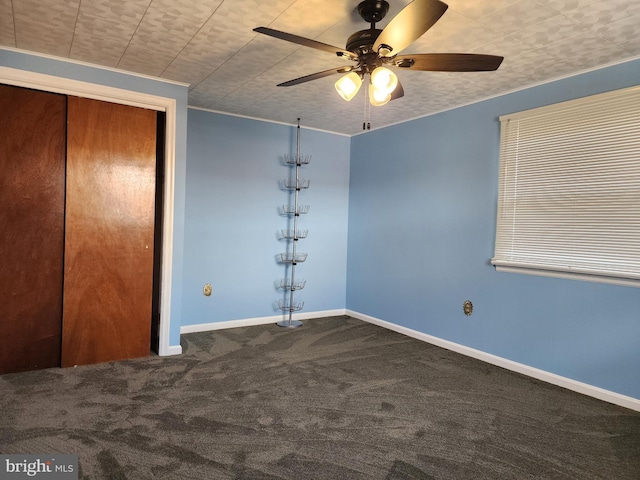 unfurnished bedroom with carpet floors, ceiling fan, and a closet