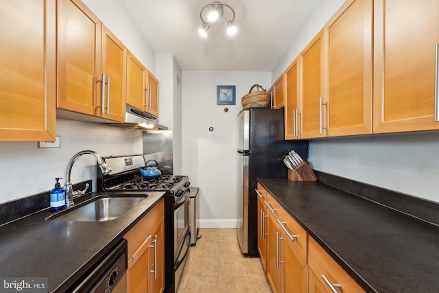 kitchen featuring light tile patterned flooring, sink, and stainless steel appliances