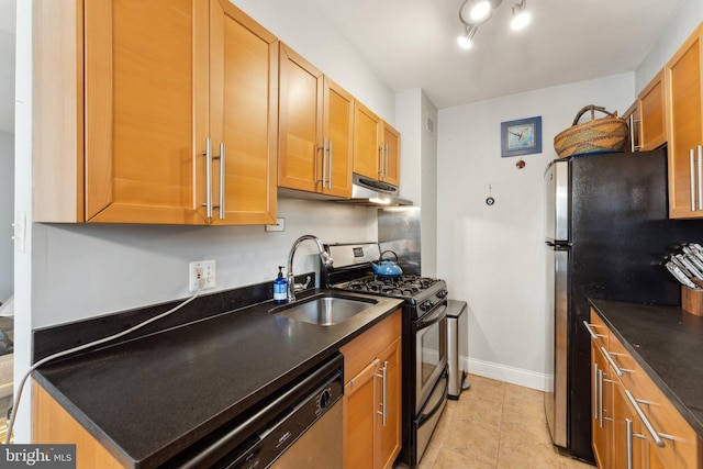 kitchen featuring sink, stainless steel appliances, and light tile patterned floors