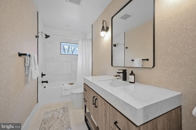 bathroom with visible vents, toilet, shower / bath combo with shower curtain, vanity, and tile patterned floors