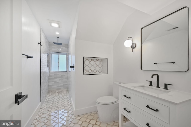 bathroom with a stall shower, baseboards, visible vents, toilet, and vanity