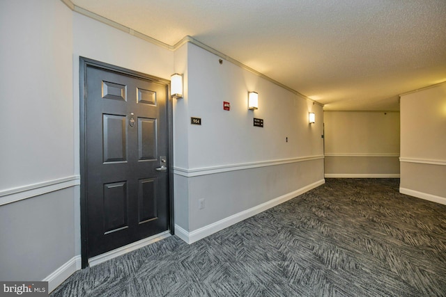 interior space featuring crown molding and a textured ceiling