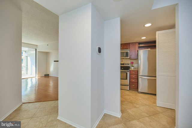 hallway featuring light tile patterned floors