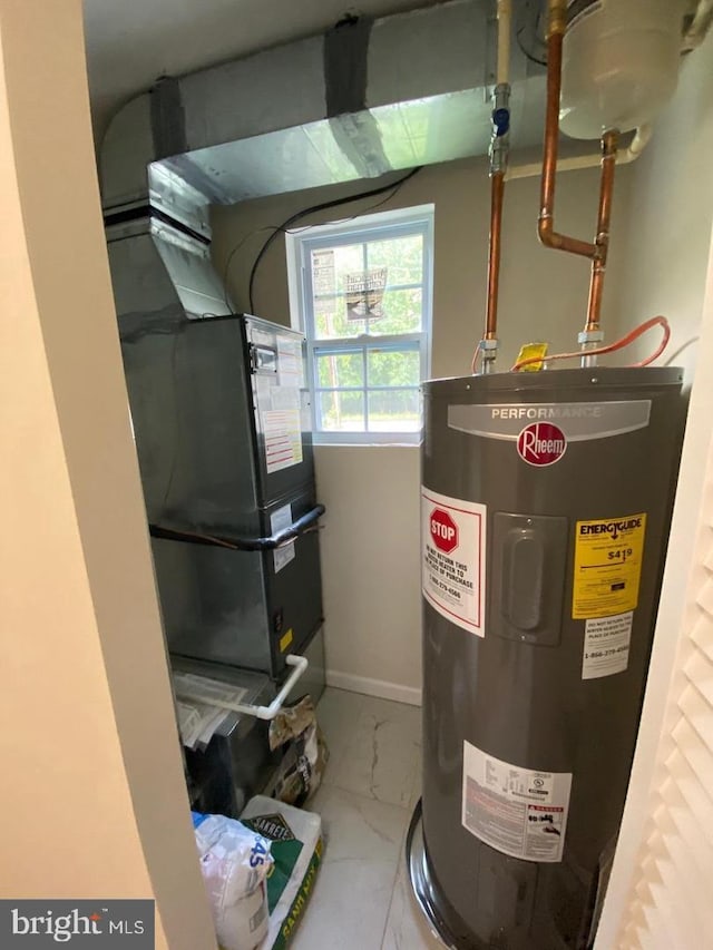 utility room featuring electric water heater