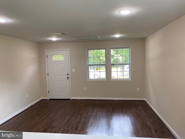 entryway featuring dark wood-style floors, visible vents, and baseboards