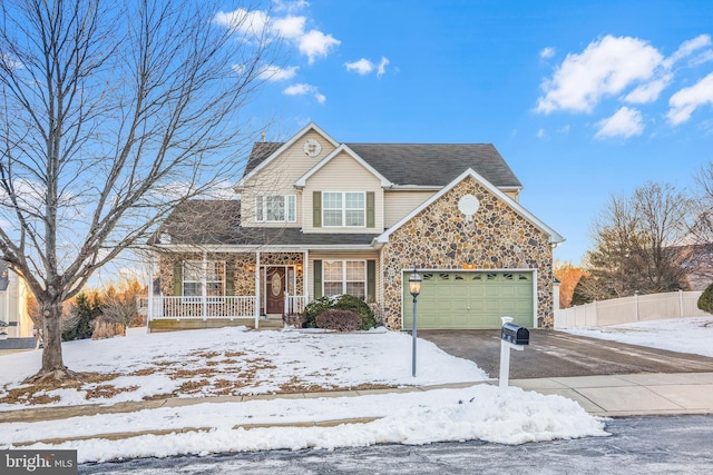 front of property with a garage and a porch