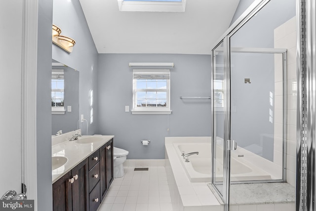 full bathroom featuring independent shower and bath, vanity, tile patterned flooring, and toilet