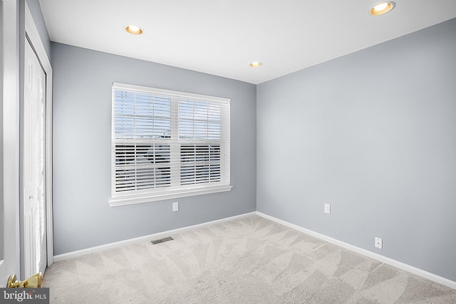 view of carpeted spare room