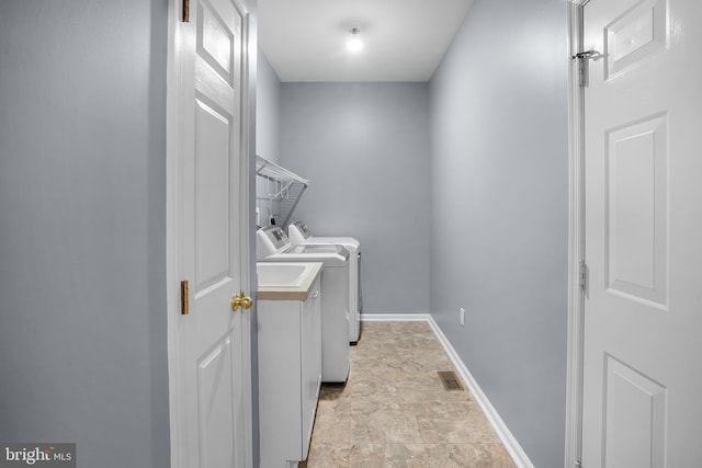 washroom featuring washer and dryer