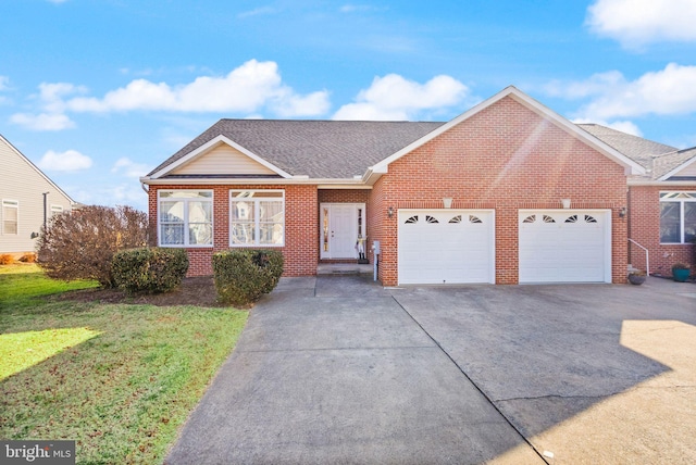 view of front of property with a garage and a front yard