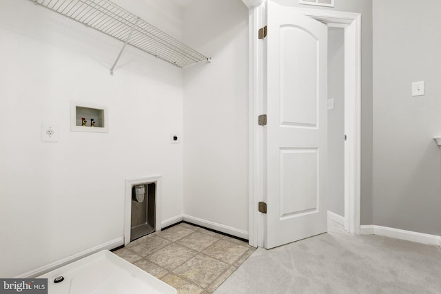 laundry area with hookup for a washing machine, hookup for an electric dryer, visible vents, and baseboards