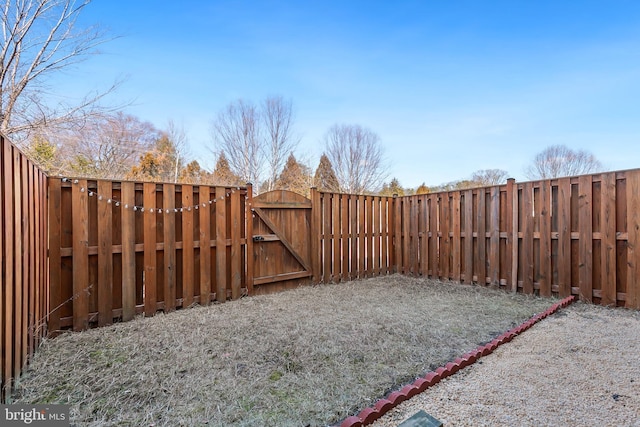 view of yard featuring a gate and fence