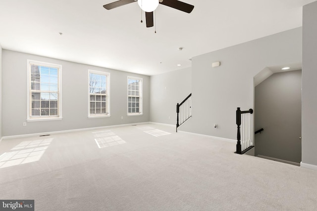 interior space featuring recessed lighting, light colored carpet, and baseboards