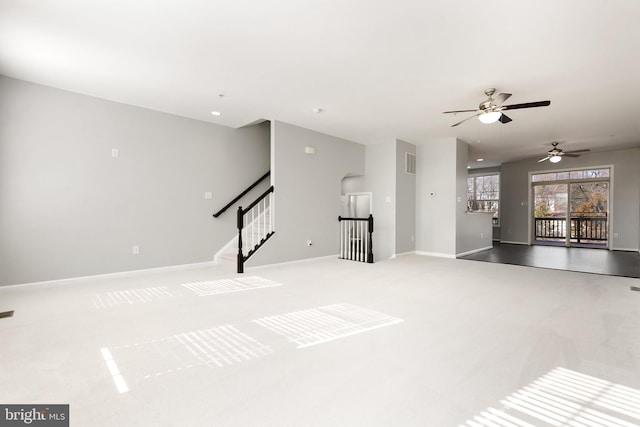 unfurnished living room with stairway, carpet flooring, visible vents, and baseboards