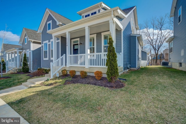 view of front of house featuring cooling unit, a front yard, and a porch