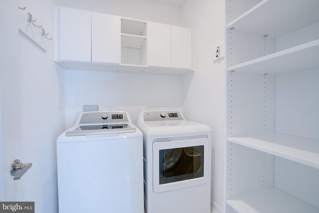 laundry area featuring cabinet space and washing machine and dryer